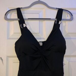 black sleeveless romper, comes from a smoke free and pet free home